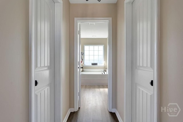 208 Chippingwood Cir, Pooler, GA 31322 - hallway with dark wood-style floors and baseboards