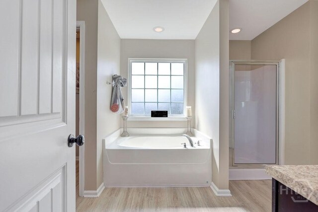 208 Chippingwood Cir, Pooler, GA 31322 - bathroom with a shower stall, a bath, wood finished floors, and vanity