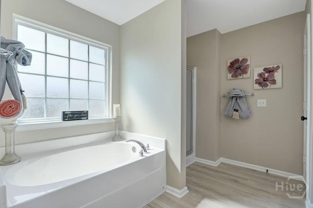 208 Chippingwood Cir, Pooler, GA 31322 - bathroom with a garden tub, wood finished floors, and a stall shower