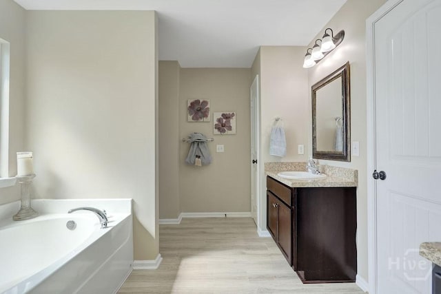 208 Chippingwood Cir, Pooler, GA 31322 - bathroom with vanity, wood finished floors, and a garden tub
