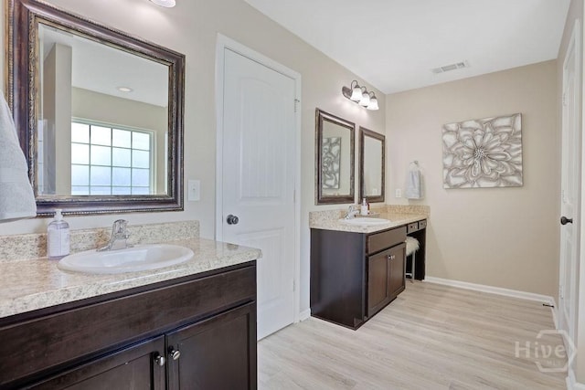208 Chippingwood Cir, Pooler, GA 31322 - bathroom featuring wood finished floors and two vanities