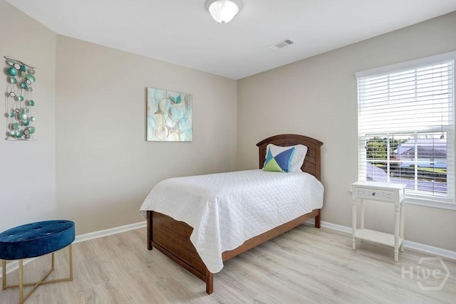 208 Chippingwood Cir, Pooler, GA 31322 - bedroom with light wood-type flooring and baseboards