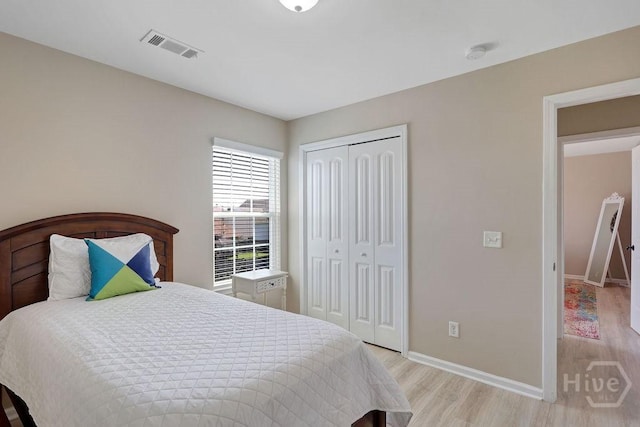 208 Chippingwood Cir, Pooler, GA 31322 - bedroom with light wood finished floors and a closet
