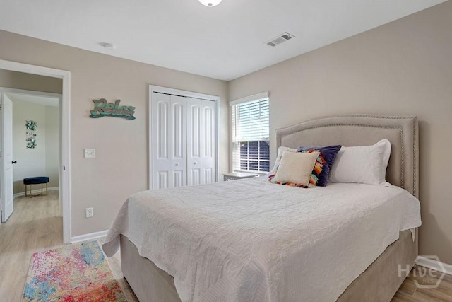 208 Chippingwood Cir, Pooler, GA 31322 - bedroom with light wood-type flooring and a closet