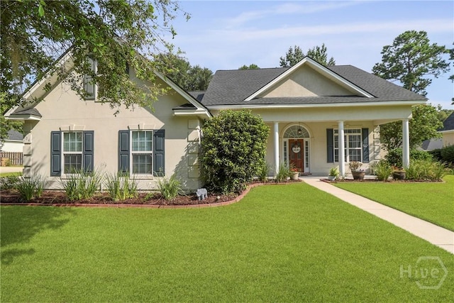 204 Bristol Way, Richmond Hill, GA 31324 - view of front of house with stucco siding, a front lawn, a porch, and a shingled roof