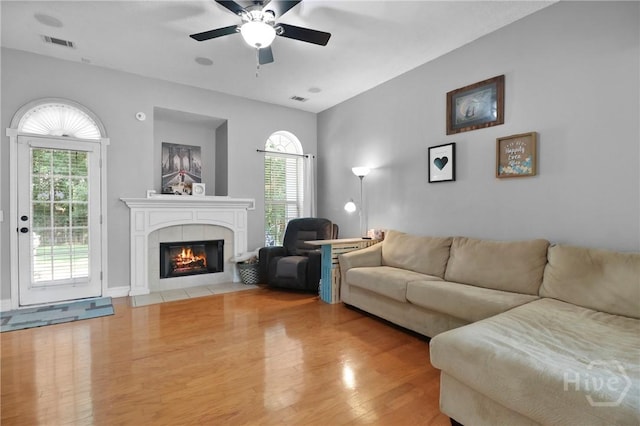 204 Bristol Way, Richmond Hill, GA 31324 - living room featuring a fireplace, light wood-type flooring, healthy amount of natural light, and ceiling fan