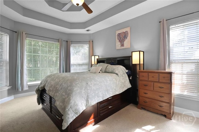 204 Bristol Way, Richmond Hill, GA 31324 - bedroom with light colored carpet, ceiling fan, and a tray ceiling