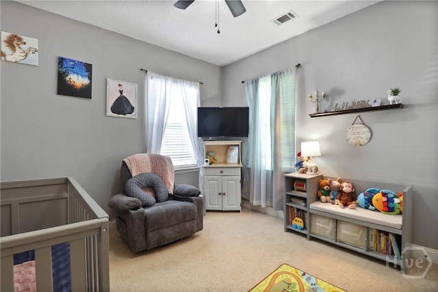 204 Bristol Way, Richmond Hill, GA 31324 - carpeted bedroom featuring a crib and a ceiling fan