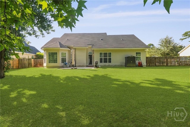 204 Bristol Way, Richmond Hill, GA 31324 - back of property featuring stucco siding, a fenced backyard, a patio, and a shingled roof