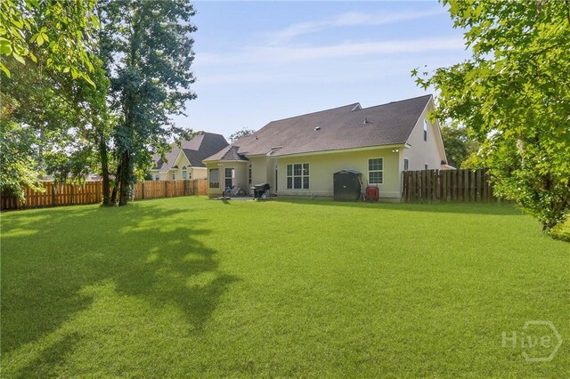 204 Bristol Way, Richmond Hill, GA 31324 - rear view of property with a fenced backyard and stucco siding