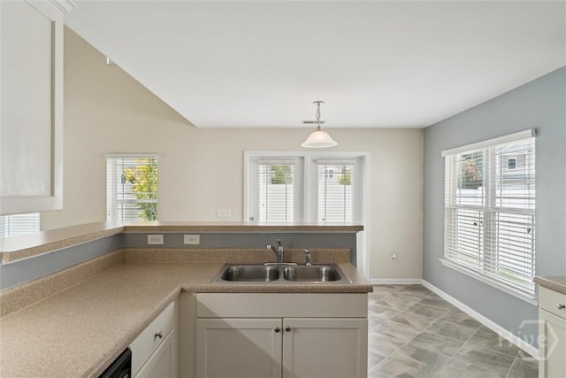 205 Summer Hill Ct, Richmond Hill, GA 31324 - kitchen featuring decorative light fixtures, white cabinets, and dishwashing machine