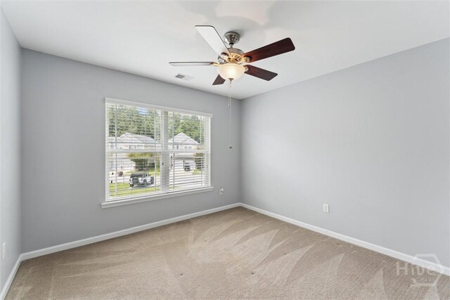 205 Summer Hill Ct, Richmond Hill, GA 31324 - empty room with carpet floors and a ceiling fan