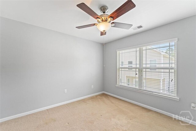 205 Summer Hill Ct, Richmond Hill, GA 31324 - unfurnished room with light carpet, plenty of natural light, and ceiling fan