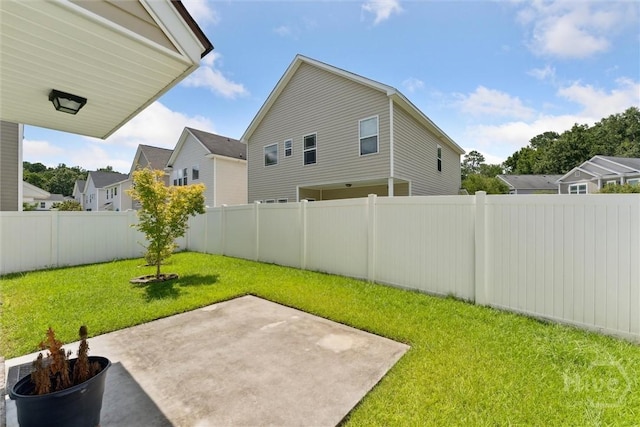 205 Summer Hill Ct, Richmond Hill, GA 31324 - fenced backyard featuring a patio area and a residential view