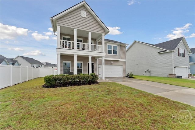 103 Williams Dr, Rincon, GA 31326 - view of front of house featuring a balcony, an attached garage, and driveway