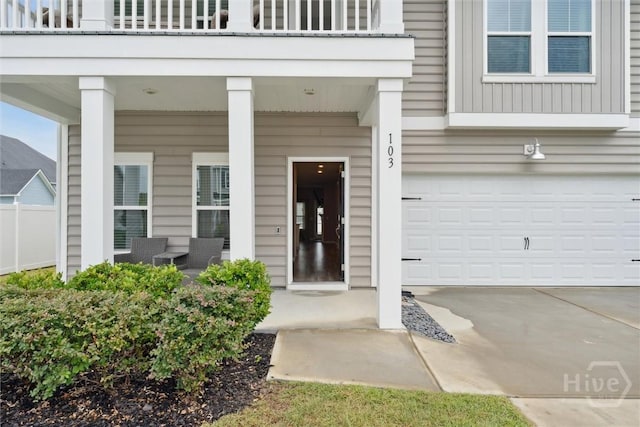 103 Williams Dr, Rincon, GA 31326 - entrance to property featuring a balcony, an attached garage, and driveway