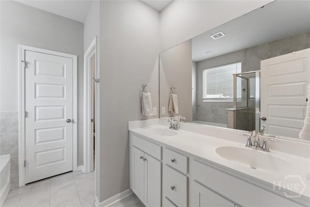 103 Williams Dr, Rincon, GA 31326 - full bath featuring double vanity, a stall shower, a garden tub, and tile patterned floors