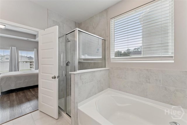103 Williams Dr, Rincon, GA 31326 - bathroom featuring a garden tub, a shower stall, ensuite bathroom, and tile patterned flooring