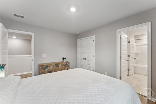 103 Williams Dr, Rincon, GA 31326 - bedroom with ensuite bathroom, wood finished floors, and recessed lighting