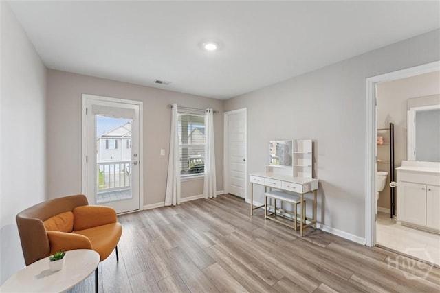 103 Williams Dr, Rincon, GA 31326 - sitting room with light wood-style floors and baseboards