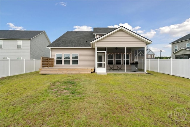 103 Williams Dr, Rincon, GA 31326 - rear view of house with a sunroom, a fenced backyard, and roof with shingles