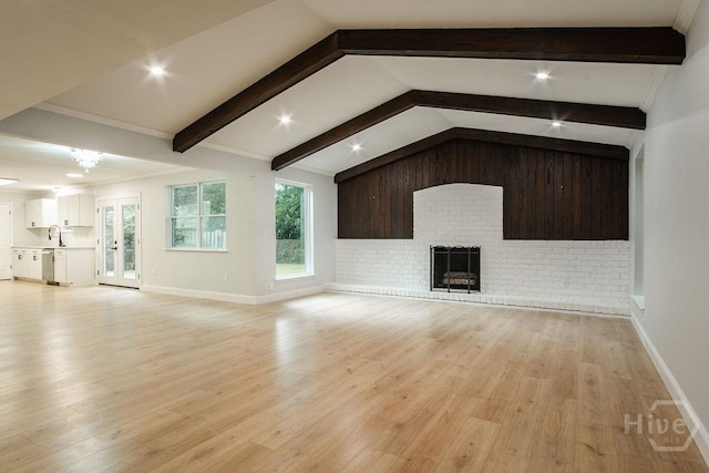 12902 Canterbury Rd, Savannah, GA 31419 - unfurnished living room with a brick fireplace, light wood-style flooring, and recessed lighting