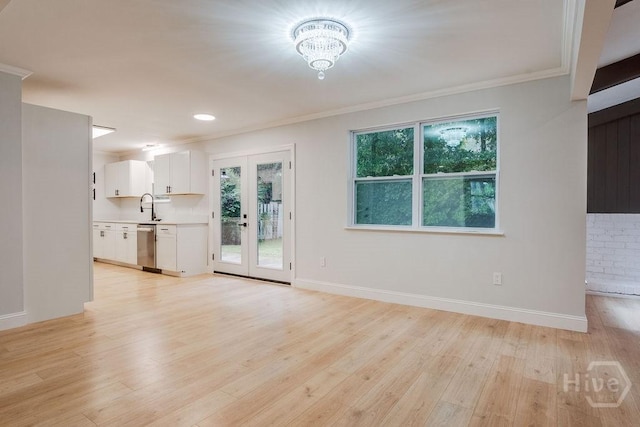 12902 Canterbury Rd, Savannah, GA 31419 - unfurnished living room with light wood-style floors, ornamental molding, a chandelier, french doors, and recessed lighting