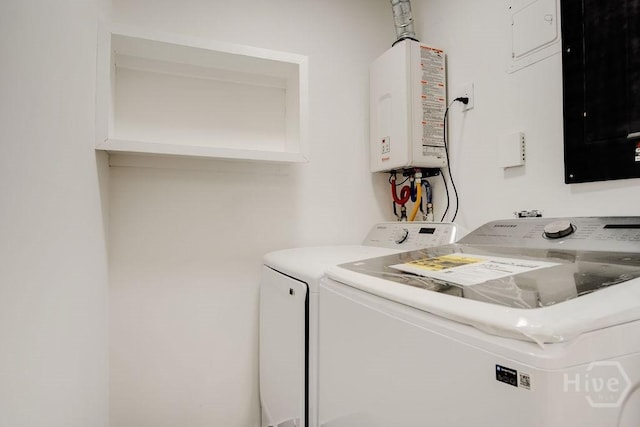 12902 Canterbury Rd, Savannah, GA 31419 - laundry room featuring washer and clothes dryer, tankless water heater, and electric panel