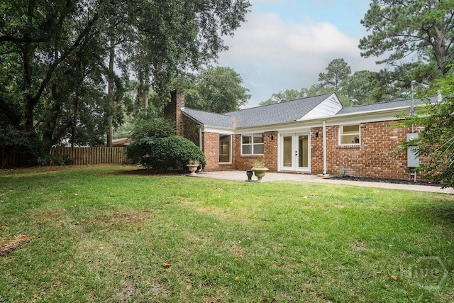 12902 Canterbury Rd, Savannah, GA 31419 - back of property with french doors, a chimney, a patio, brick siding, and roof with shingles
