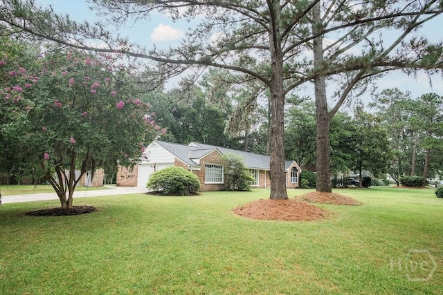 12902 Canterbury Rd, Savannah, GA 31419 - view of front facade featuring a garage, concrete driveway, a front lawn, and brick siding