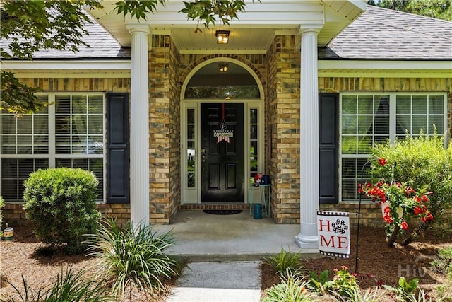 11 Rialto Ct, Pooler, GA 31322 - view of exterior entry featuring a shingled roof, brick siding, and a porch