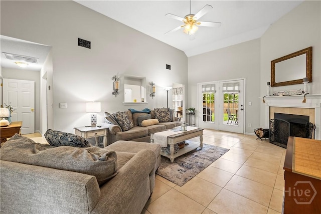 11 Rialto Ct, Pooler, GA 31322 - living room featuring high vaulted ceiling, light tile patterned floors, a ceiling fan, and a tiled fireplace