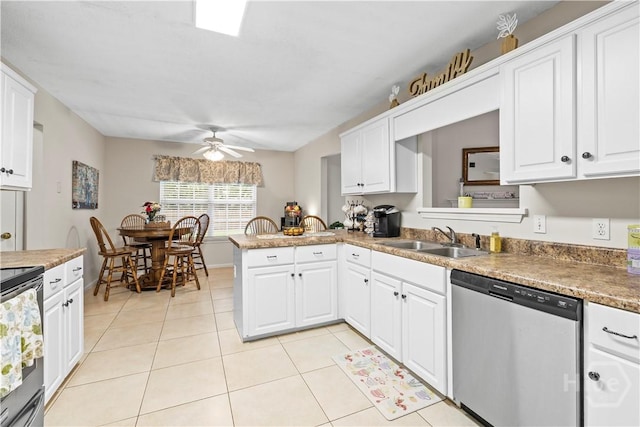 11 Rialto Ct, Pooler, GA 31322 - kitchen featuring appliances with stainless steel finishes, light tile patterned flooring, ceiling fan, white cabinetry, and a peninsula