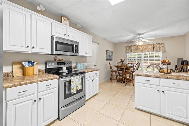 11 Rialto Ct, Pooler, GA 31322 - kitchen with appliances with stainless steel finishes, ceiling fan, and white cabinetry