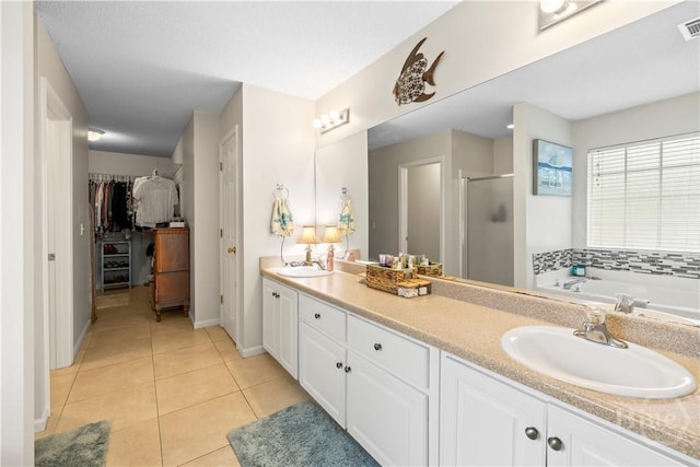 11 Rialto Ct, Pooler, GA 31322 - bathroom with a stall shower, tile patterned floors, double vanity, a bath, and a walk in closet