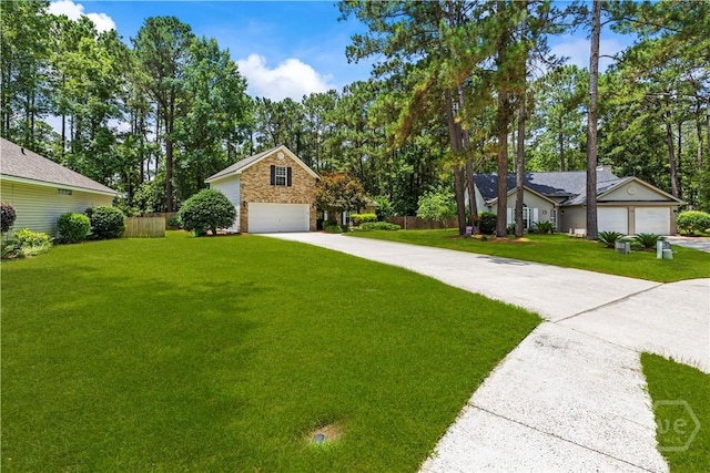 11 Rialto Ct, Pooler, GA 31322 - view of front of home featuring driveway, view of wooded area, and a garage