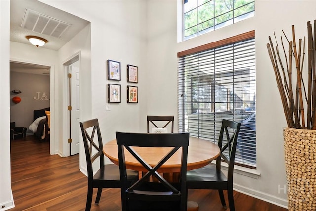 117 Barrington Rd, Pooler, GA 31322 - dining room with dark wood-style flooring and baseboards