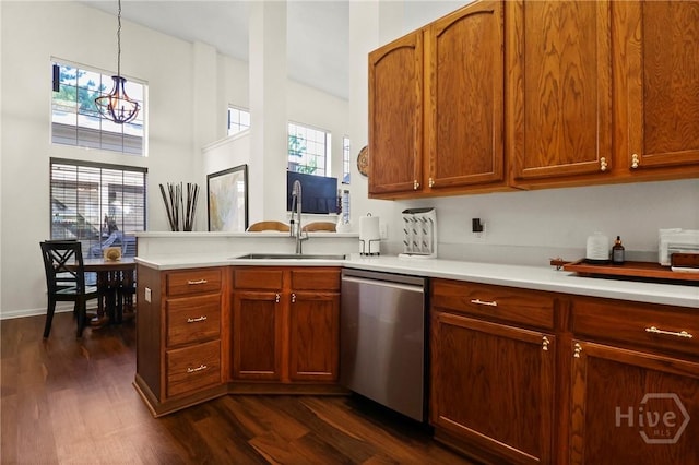 117 Barrington Rd, Pooler, GA 31322 - kitchen with dishwasher, light countertops, a peninsula, dark wood-style flooring, and decorative light fixtures