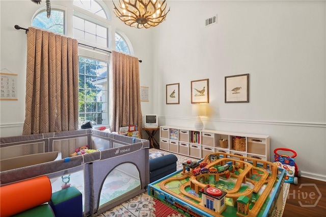 117 Barrington Rd, Pooler, GA 31322 - bedroom with a chandelier, wood finished floors, and a towering ceiling