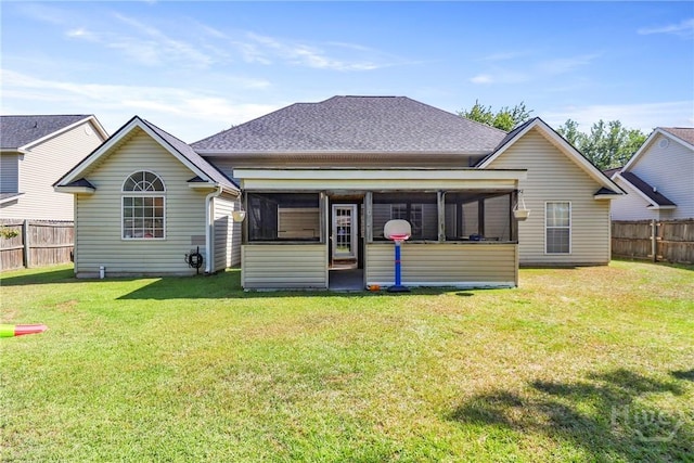 117 Barrington Rd, Pooler, GA 31322 - rear view of house featuring a sunroom, a fenced backyard, and roof with shingles