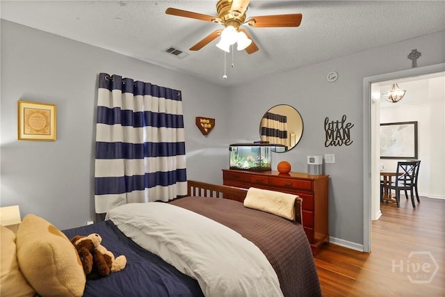 117 Barrington Rd, Pooler, GA 31322 - bedroom featuring wood finished floors and a textured ceiling