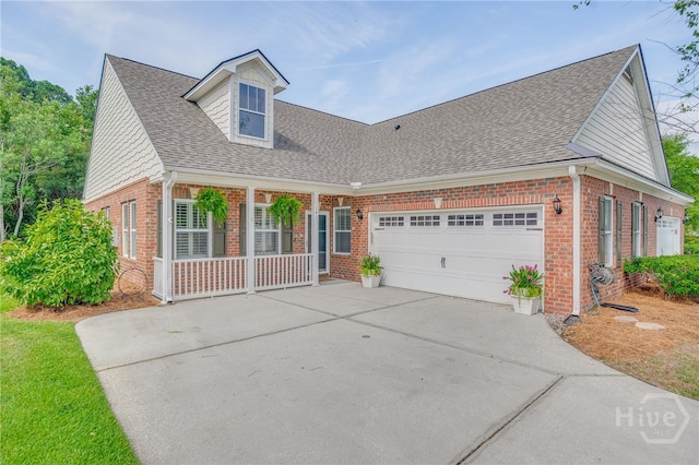 141 Regency Cir, Pooler, GA 31322 - view of front of property with brick siding, covered porch, roof with shingles, driveway, and an attached garage