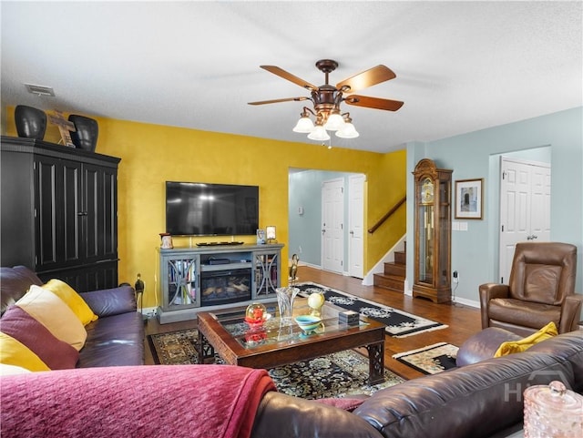 335 Winchester Dr, Pooler, GA 31322 - living room featuring a ceiling fan, stairway, and wood finished floors