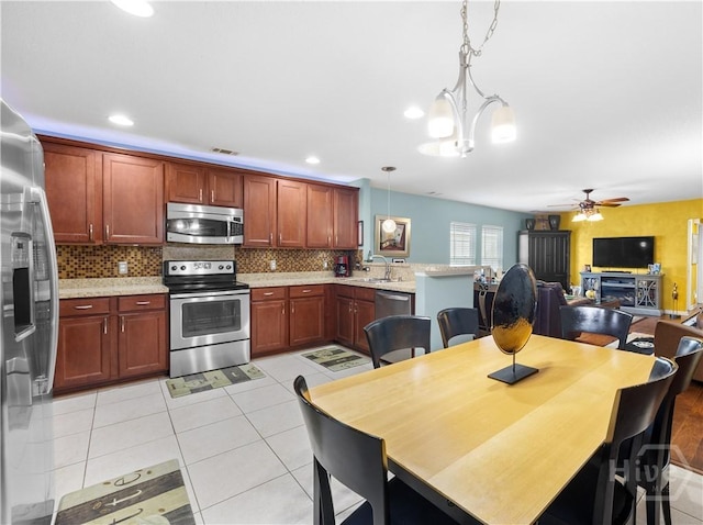 335 Winchester Dr, Pooler, GA 31322 - dining room with ceiling fan, light tile patterned flooring, and a chandelier