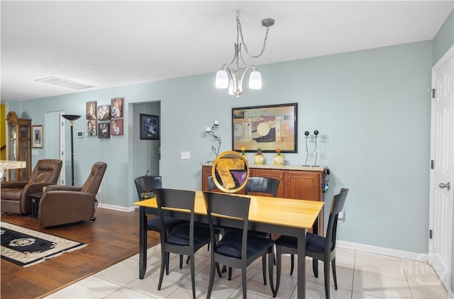 335 Winchester Dr, Pooler, GA 31322 - dining area with light tile patterned floors and a chandelier