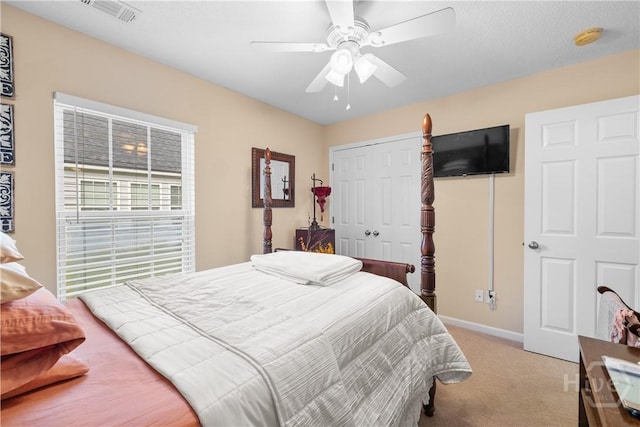 335 Winchester Dr, Pooler, GA 31322 - bedroom featuring light colored carpet, a closet, and a ceiling fan