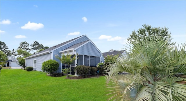 335 Winchester Dr, Pooler, GA 31322 - view of home's exterior with a yard and a sunroom