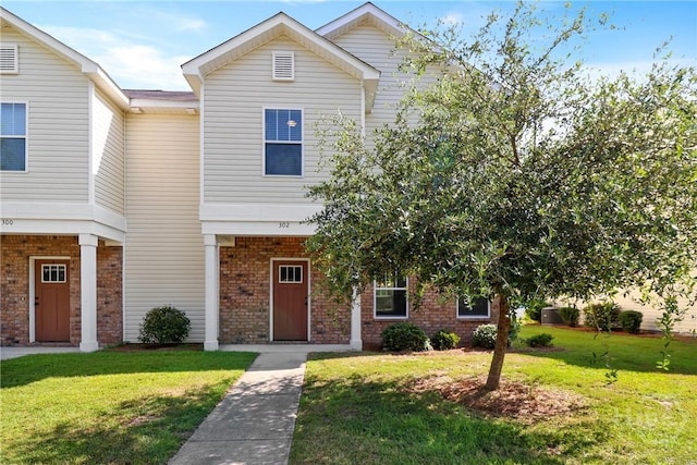 302 Morgan Pines Dr, Pooler, GA 31322 - townhome / multi-family property with brick siding and a front yard