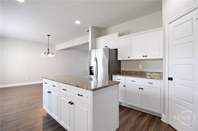 302 Morgan Pines Dr, Pooler, GA 31322 - kitchen with stainless steel fridge, dark wood finished floors, recessed lighting, white cabinets, and a center island