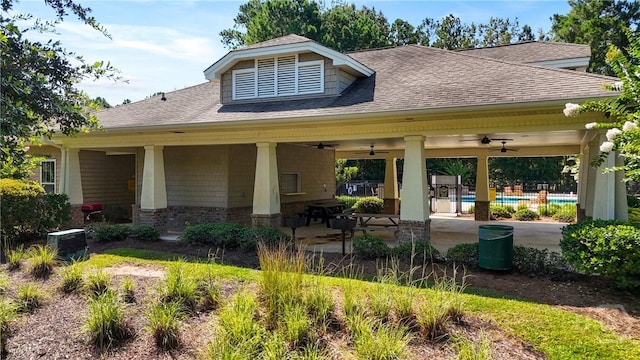 302 Morgan Pines Dr, Pooler, GA 31322 - back of house featuring ceiling fan, roof with shingles, an outdoor pool, and a patio area